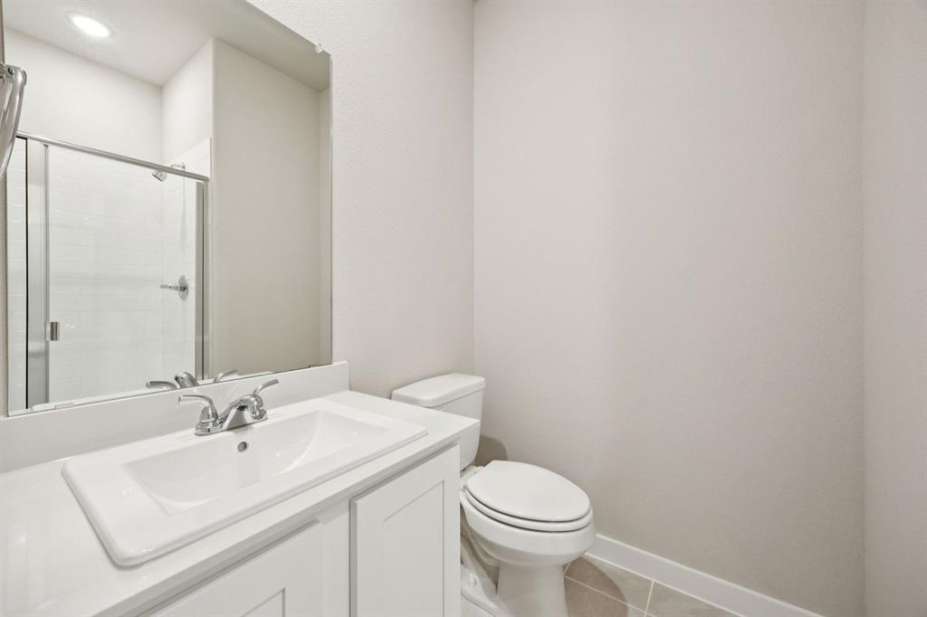 1195 Little Hls Way Lavon, TX 75166 - Photo 21 of 29 a bathroom with a sink a toilet and a mirror