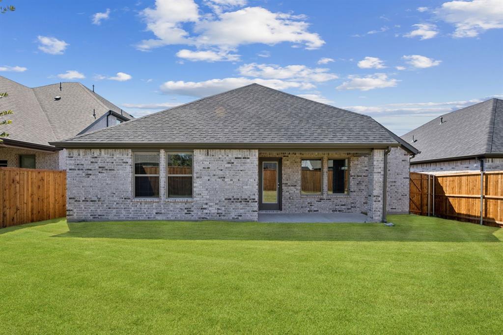 1195 Little Hls Way Lavon, TX 75166 - Photo 25 of 29 a front view of house with yard and trees in the background