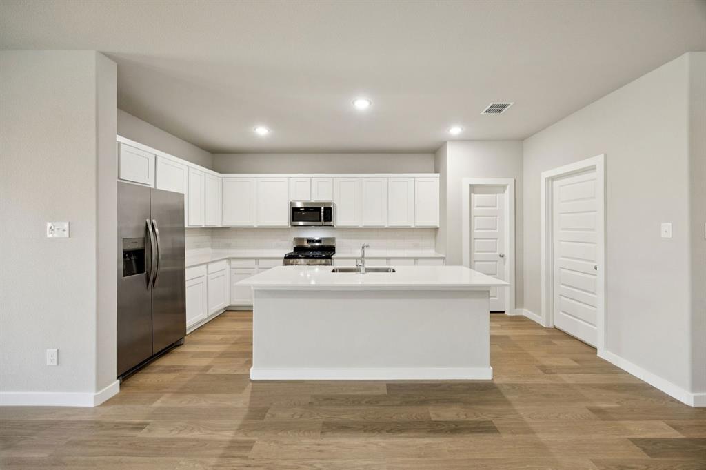 1195 Little Hls Way Lavon, TX 75166 - Photo 5 of 29 a view of kitchen with stainless steel appliances kitchen island