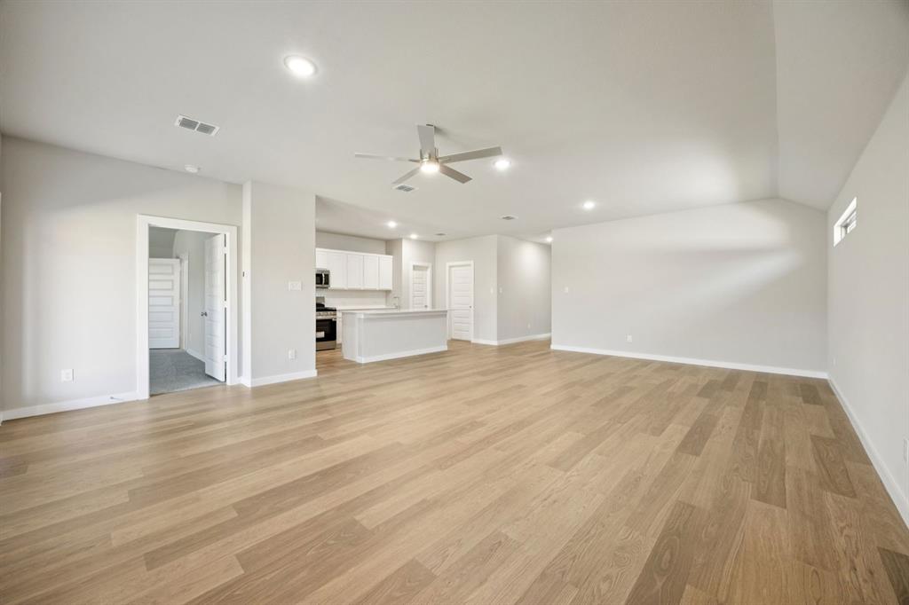 1195 Little Hls Way Lavon, TX 75166 - Photo 29 of 29 a view of kitchen and empty room with wooden floor