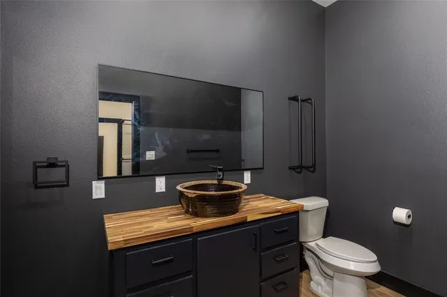 a bathroom with a sink and mirror