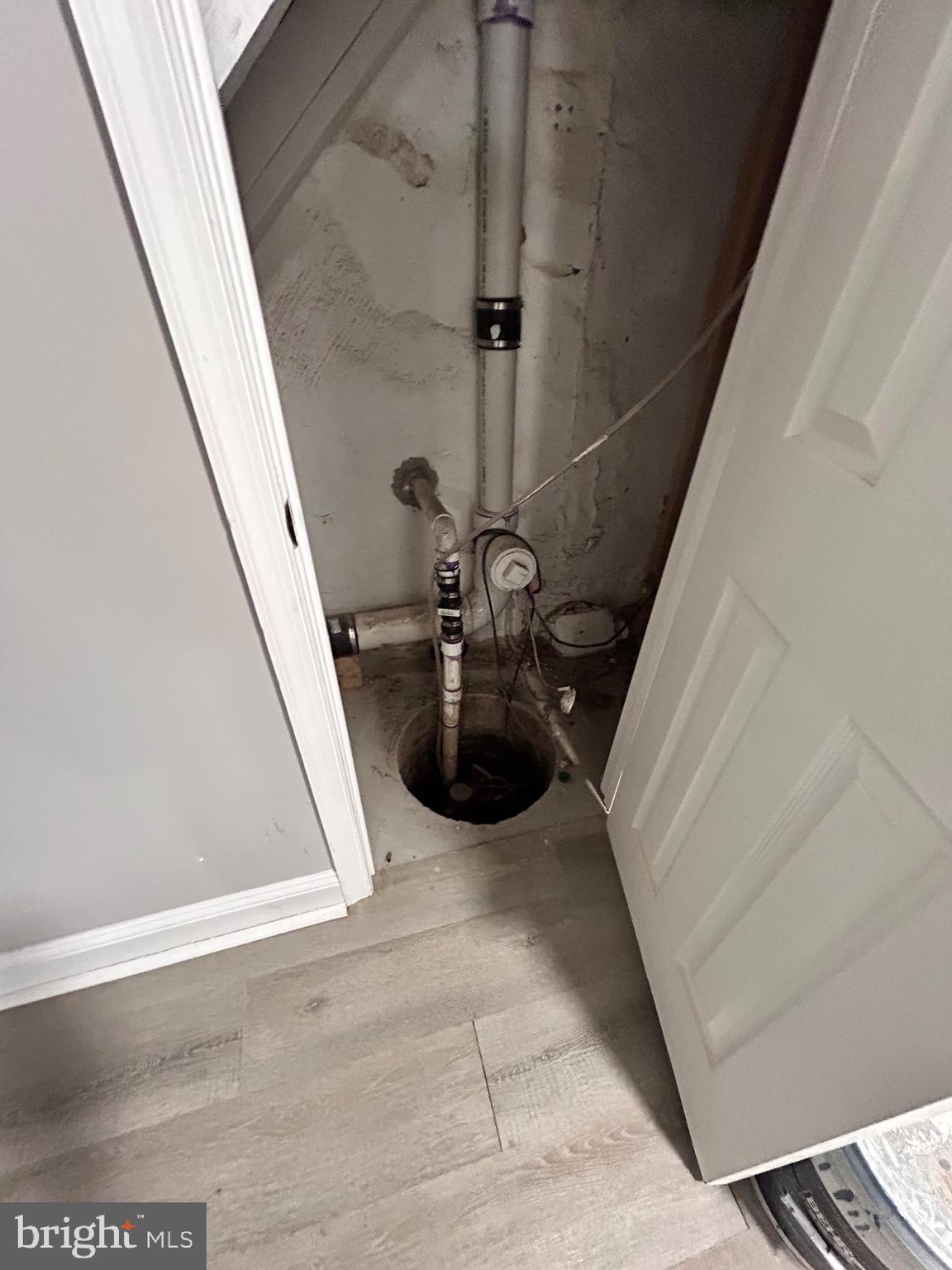 4207 Arizona Avenue Baltimore, MD 21206 - Photo 37 of 45 Basement - Sump pump under stairs