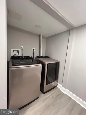 a view of hallway with wooden floor