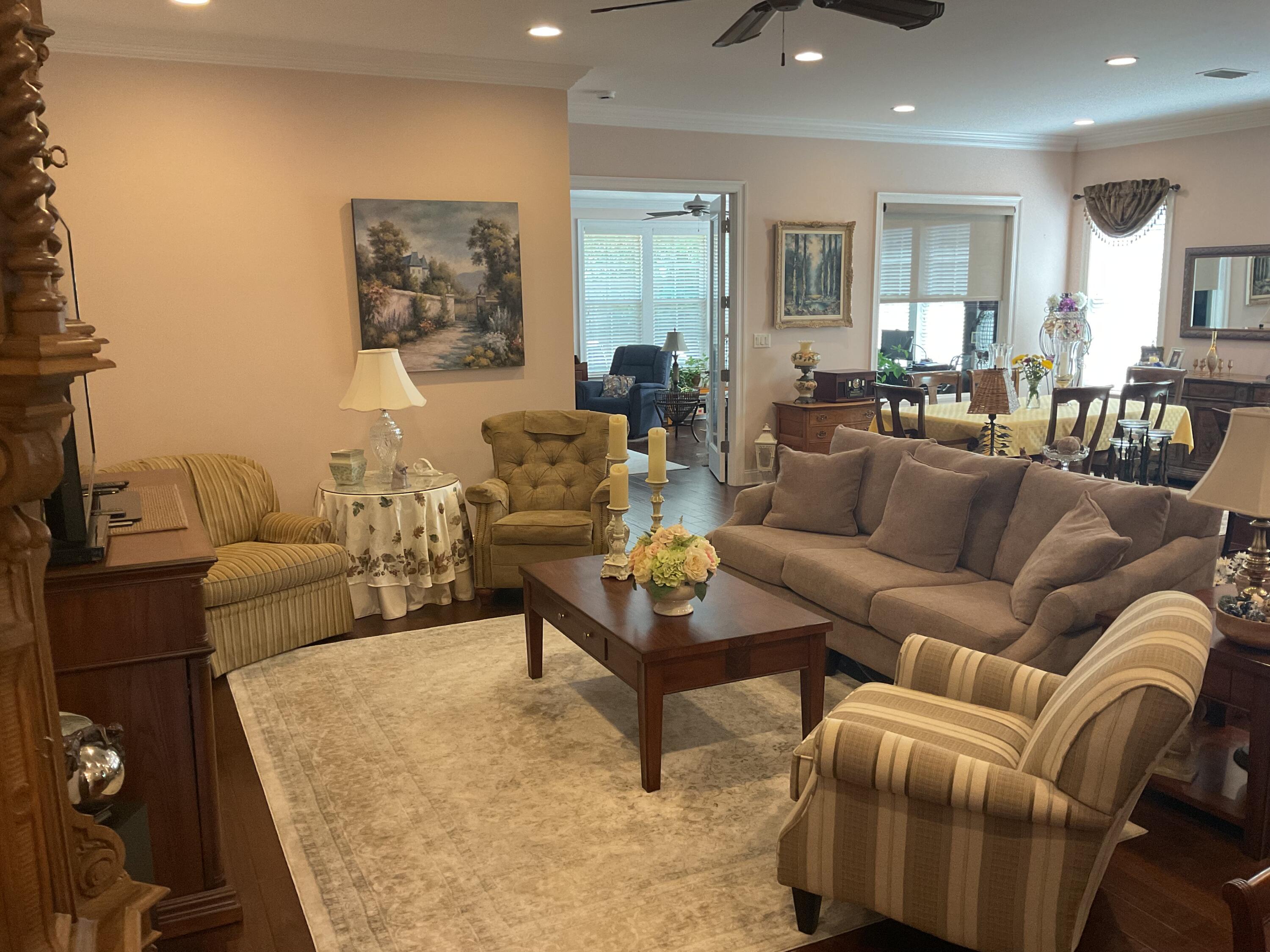 55 Derby Downs Circle Niceville, FL 32578 - Photo 14 of 34 a living room with furniture and a wooden floor