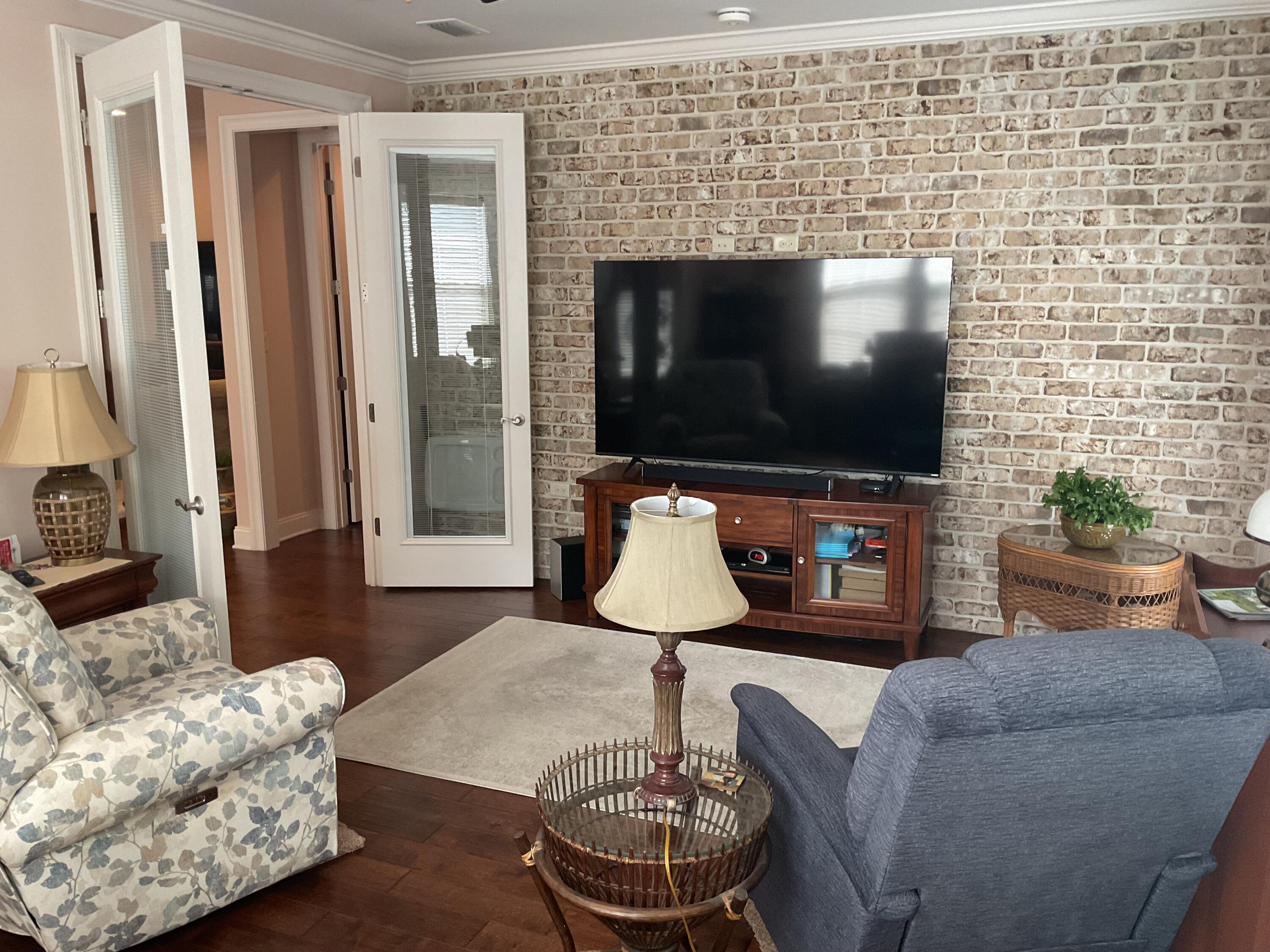 55 Derby Downs Circle Niceville, FL 32578 - Photo 21 of 34 a living room with furniture and a flat screen tv