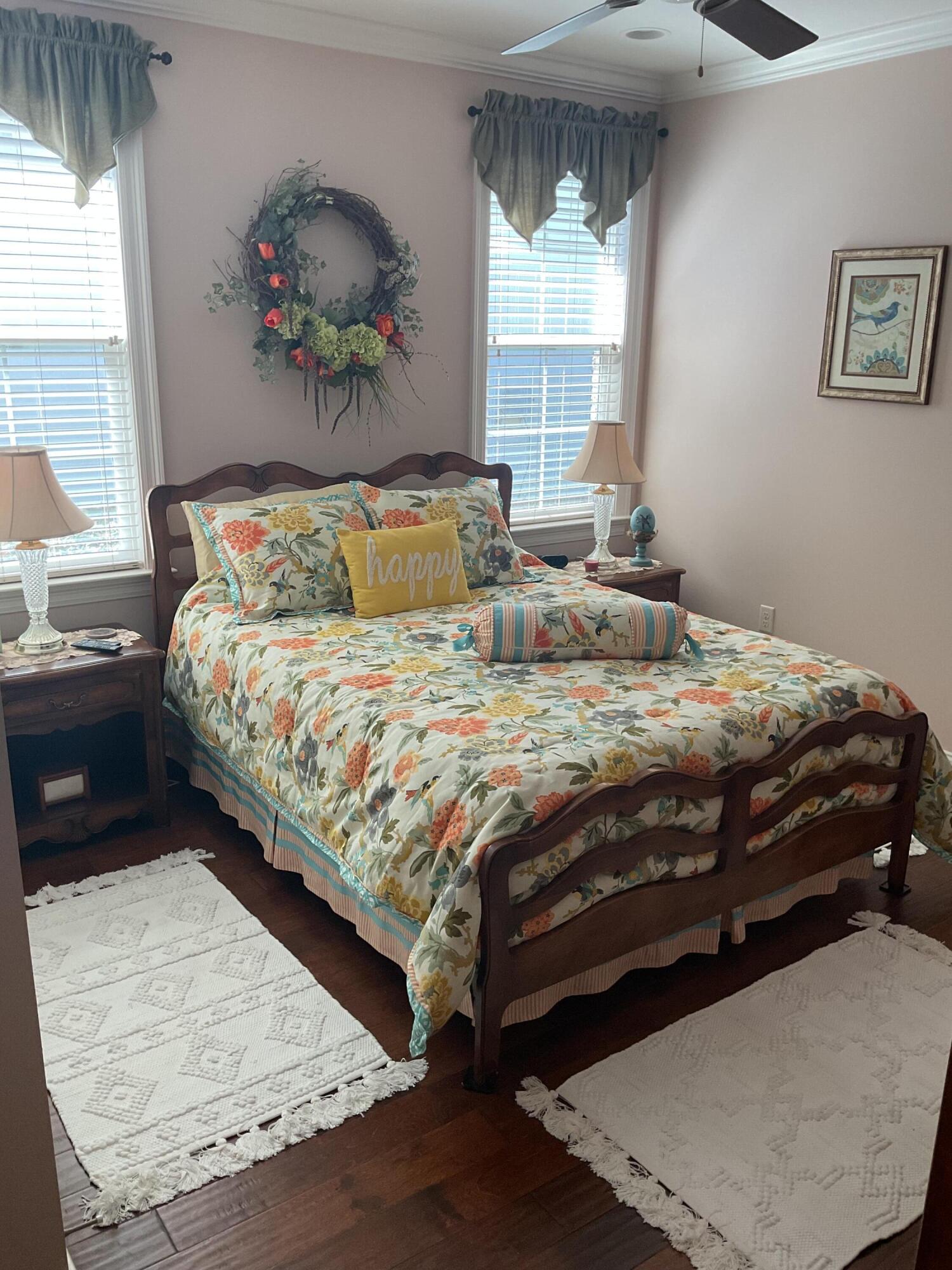 55 Derby Downs Circle Niceville, FL 32578 - Photo 24 of 34 a bedroom with a bed and a painting on the wall