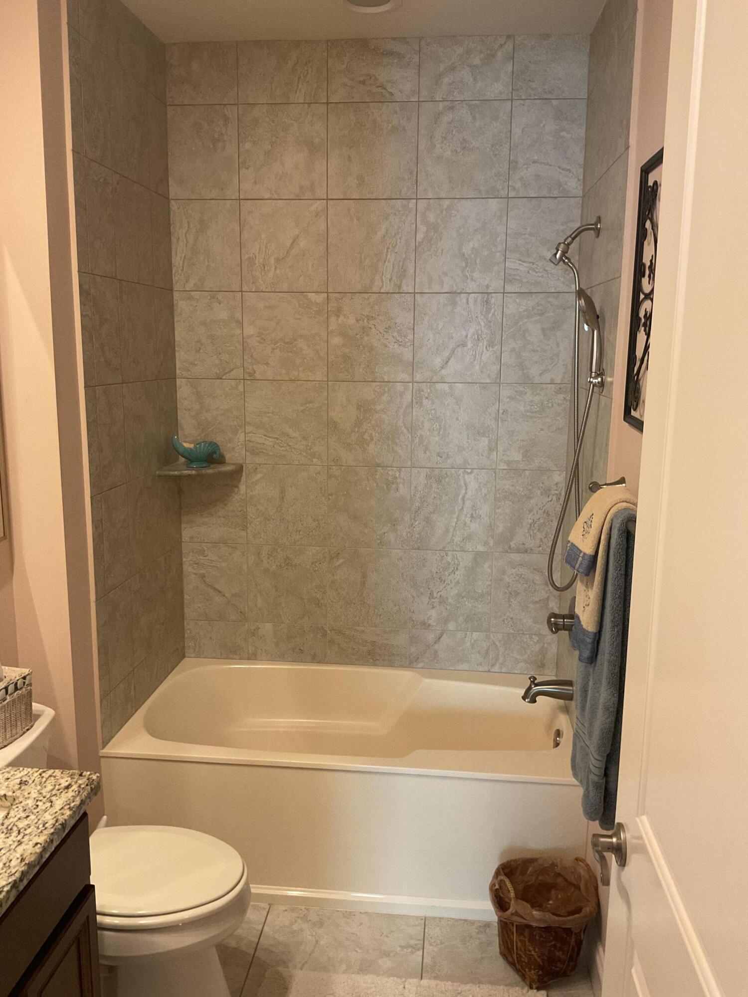 55 Derby Downs Circle Niceville, FL 32578 - Photo 26 of 34 a bathroom with a toilet bathtub vanity and shower