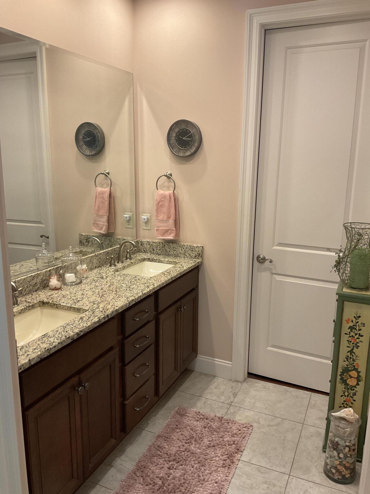 55 Derby Downs Circle Niceville, FL 32578 - Photo 28 of 34 a bathroom with a granite countertop sink and a mirror