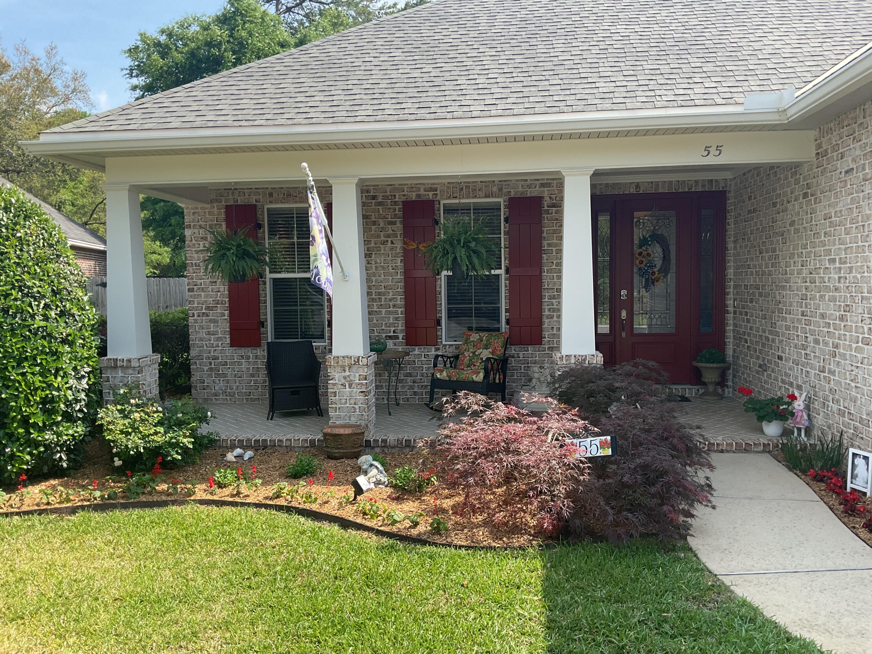 55 Derby Downs Circle Niceville, FL 32578 - Photo 3 of 34 a front view of a house with garden
