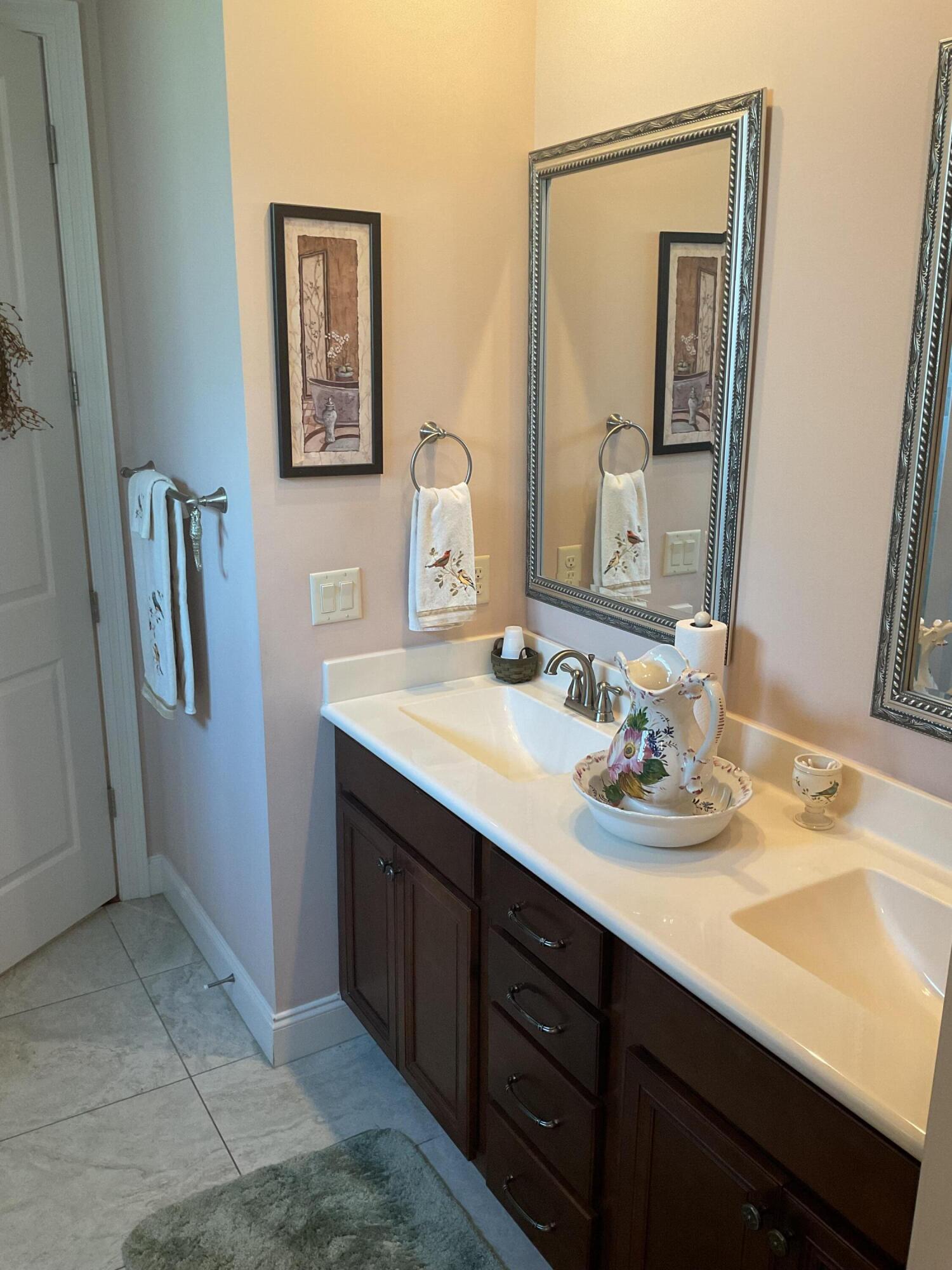 55 Derby Downs Circle Niceville, FL 32578 - Photo 33 of 34 a bathroom with a sink vanity and mirror