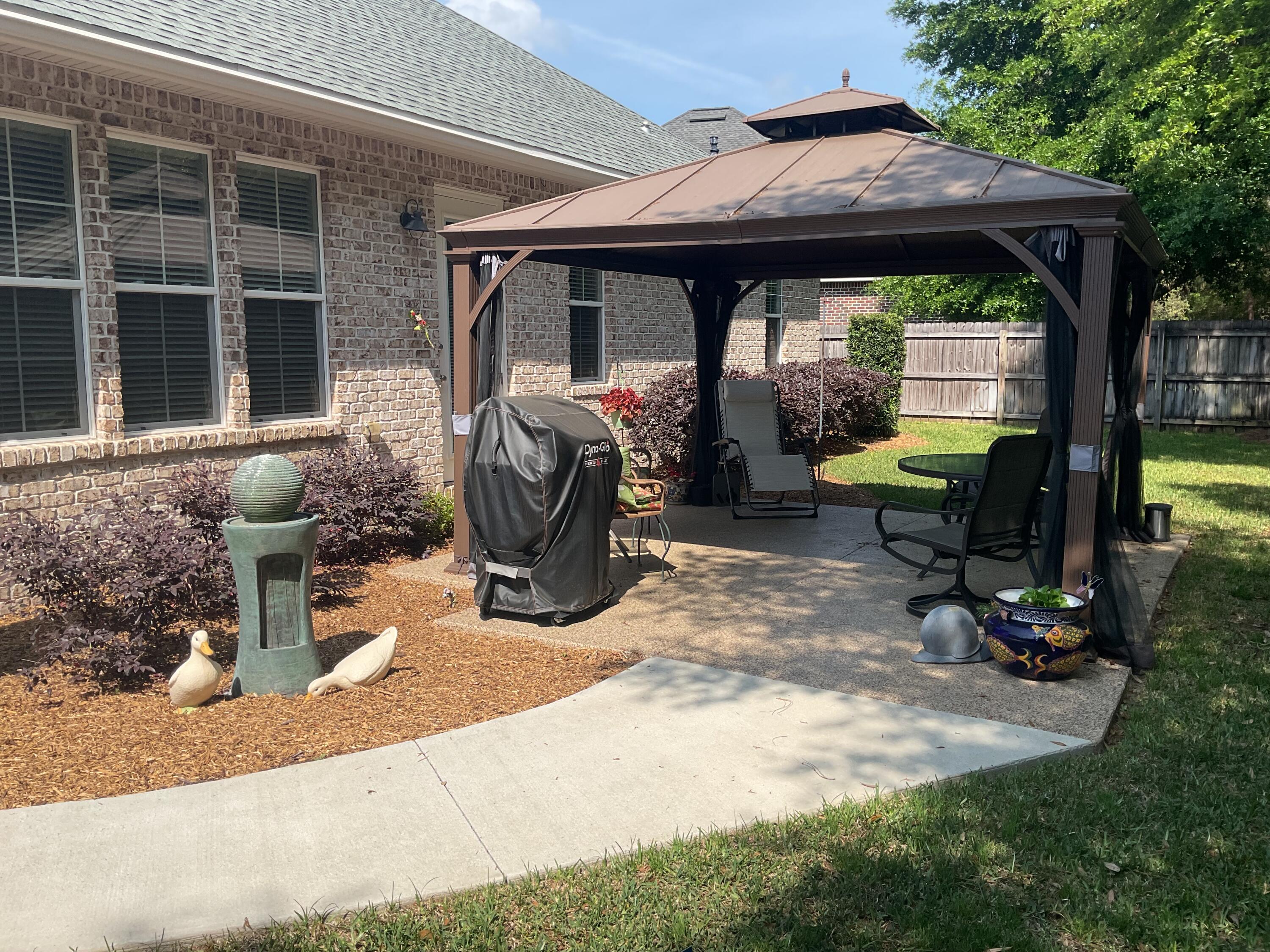 55 Derby Downs Circle Niceville, FL 32578 - Photo 10 of 34 a view of a porch with furniture and floor