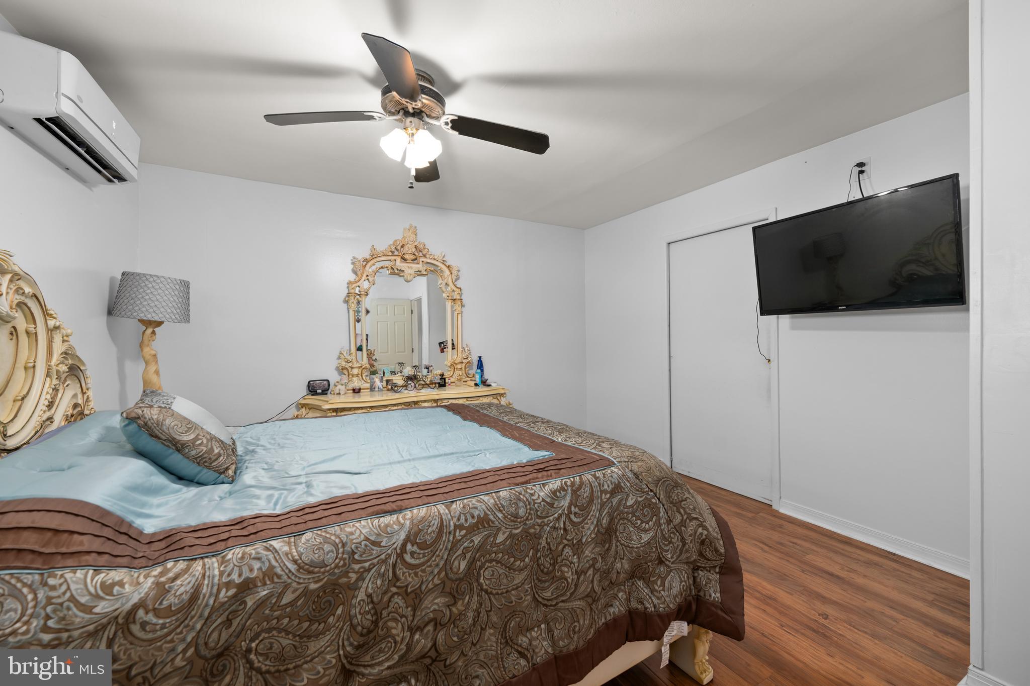 7 Gainor Road New Castle, DE 19720 - Photo 12 of 26 a bedroom with a bed and a flat screen tv