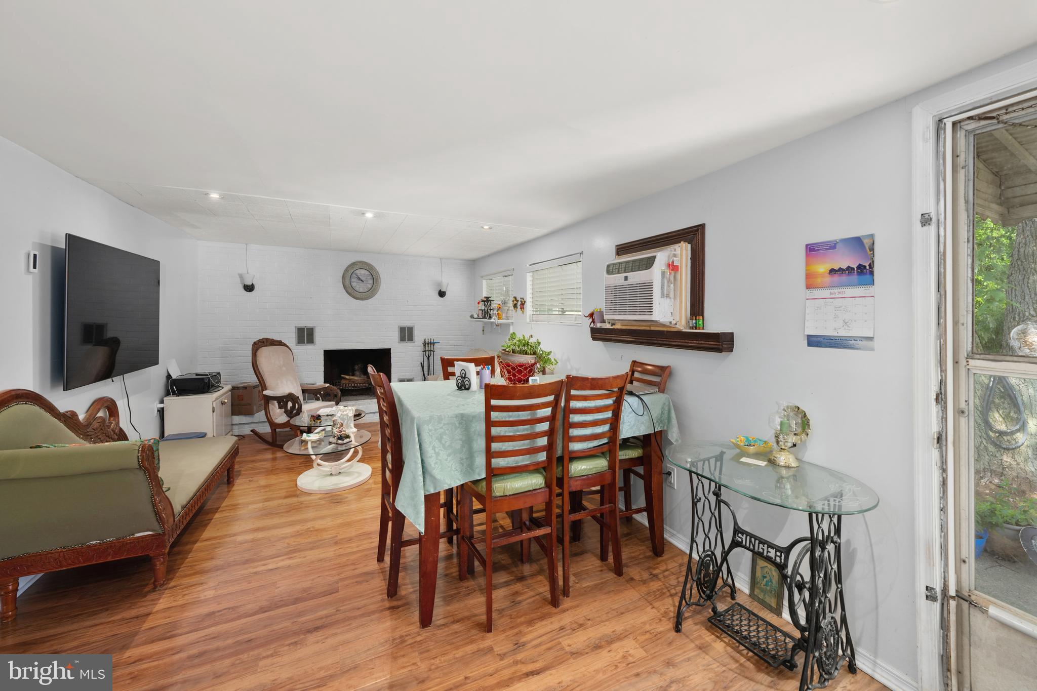 7 Gainor Road New Castle, DE 19720 - Photo 16 of 26 a living room with furniture a rug and a flat screen tv