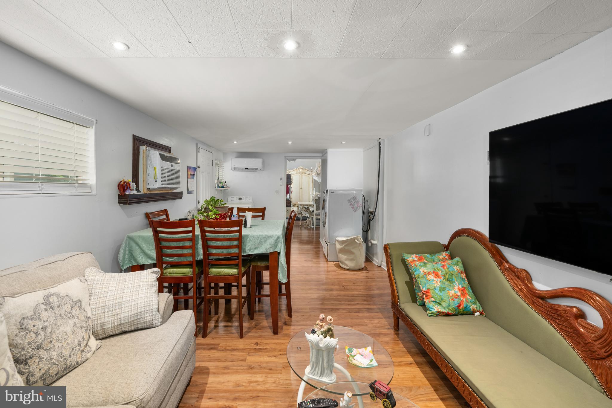 7 Gainor Road New Castle, DE 19720 - Photo 18 of 26 a living room with furniture and a flat screen tv