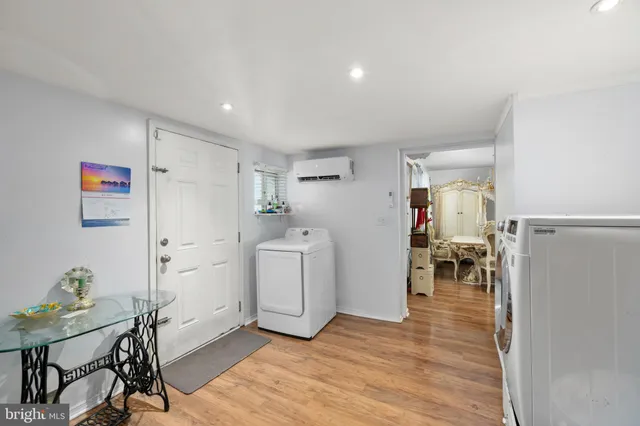 a view of a room with furniture and wooden floor