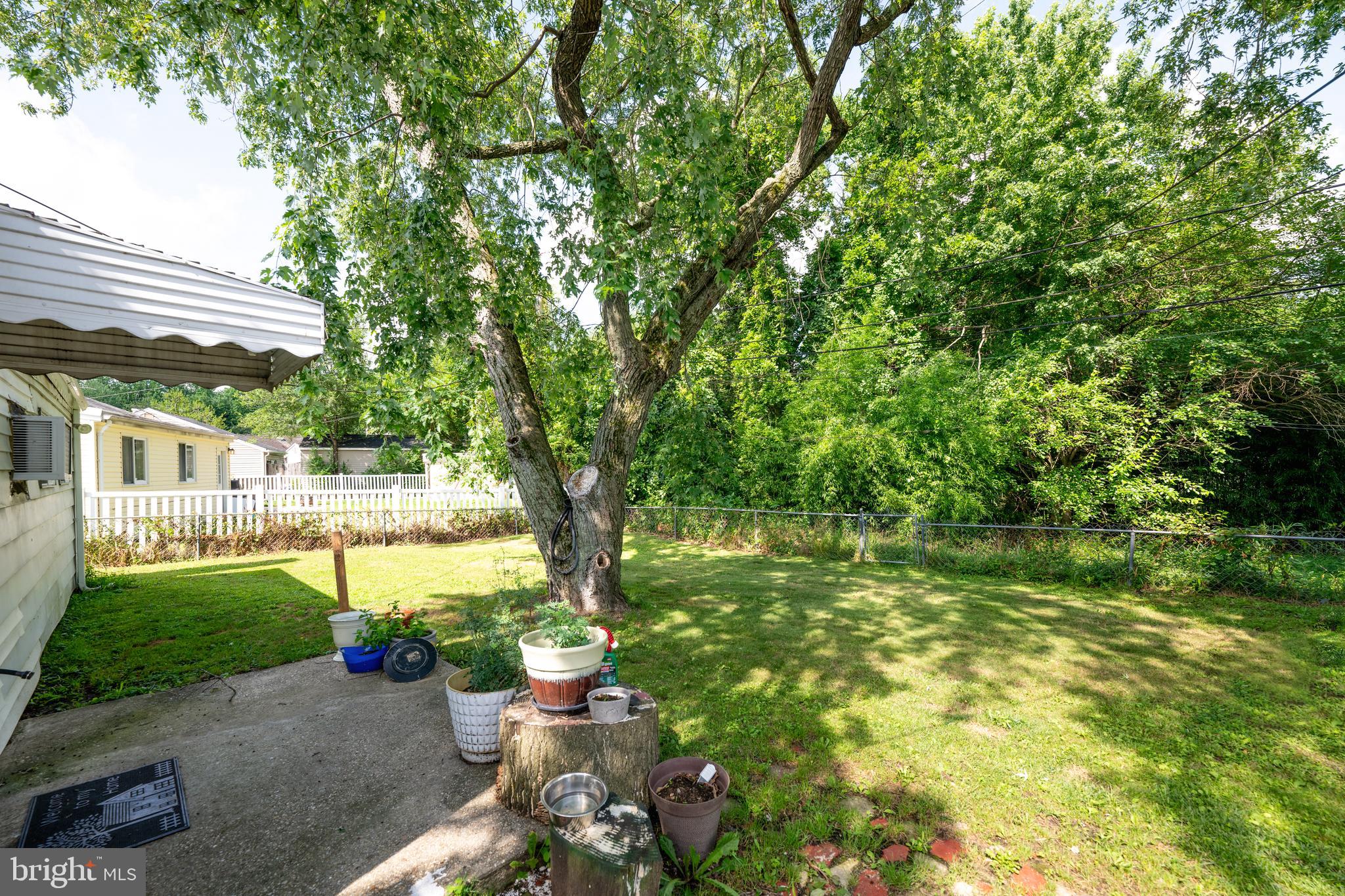 7 Gainor Road New Castle, DE 19720 - Photo 21 of 26 a view of a chair and table in the garden