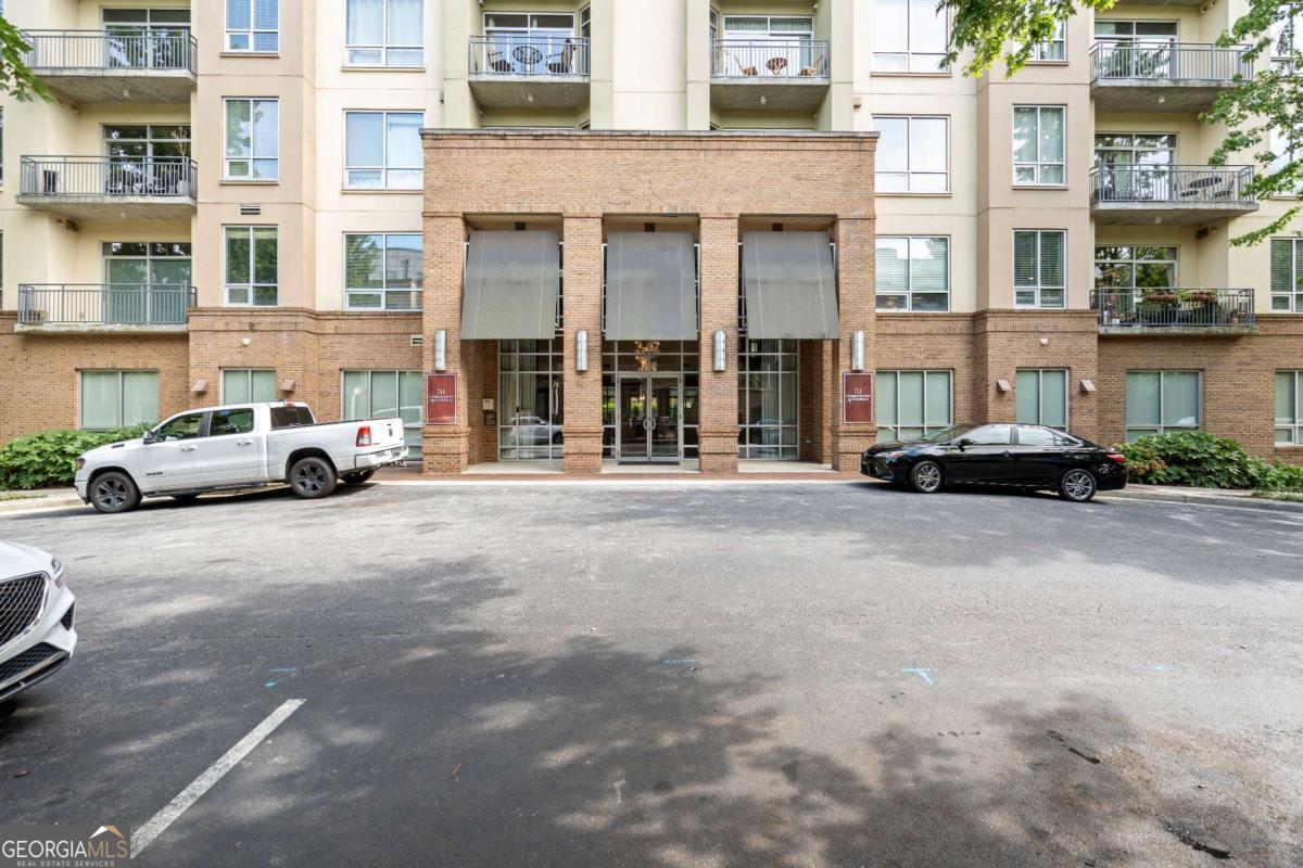 711 Cosmopolitan Drive Northeast, Unit 442 Atlanta, GA 30324 - Photo 1 of 32 a car parked in front of a building