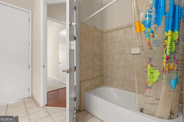 a bathroom with a tub and shower