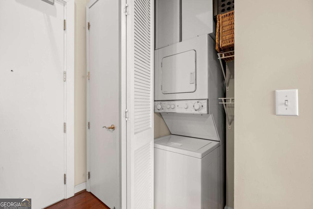 711 Cosmopolitan Drive Northeast, Unit 442 Atlanta, GA 30324 - Photo 23 of 32 a utility room with dryer and washer
