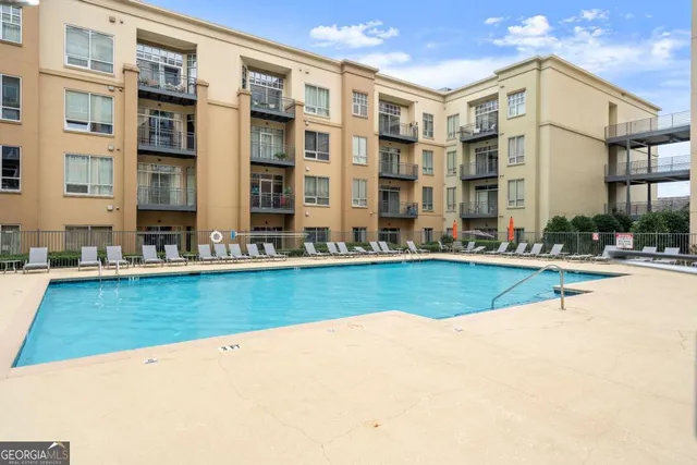 a view of pool with outdoor seating