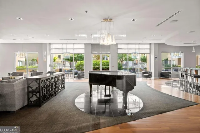 a kitchen with stainless steel appliances granite countertop a stove and white cabinets