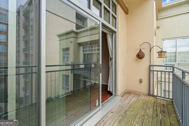 a view of balcony with wooden floor