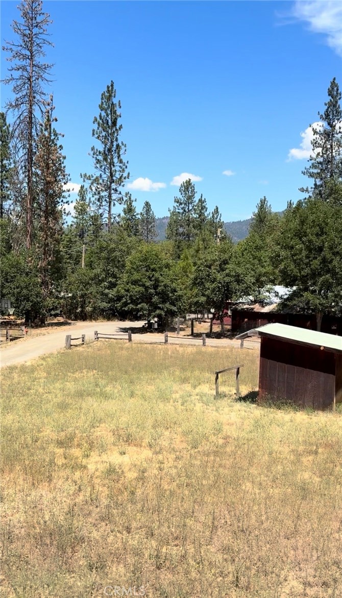 131 Locust Street Hayfork, CA 96041 - Photo 3 of 6 a view of a swimming pool with an outdoor seating and a mountain view
