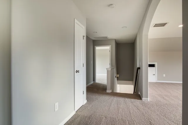 wooden floor in a hall with an entryway