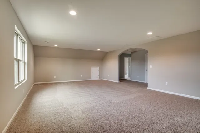 a view of empty room with windows
