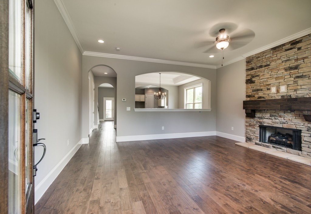 19 Bear Branch Place Joelton, TN 37080 - Photo 2 of 16 a view of a livingroom with wooden floor and a fireplace