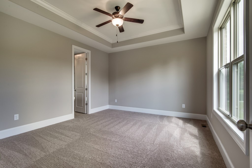 19 Bear Branch Place Joelton, TN 37080 - Photo 8 of 16 an empty room with windows and fan