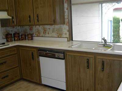 1945 Piner Road, Unit 145 Santa Rosa, CA 95403 - Photo 6 of 11 a kitchen with stainless steel appliances granite countertop a sink stove and cabinets