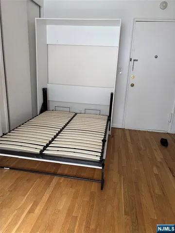 a view of front door with wooden floor