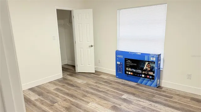 a view of an empty room with fire place