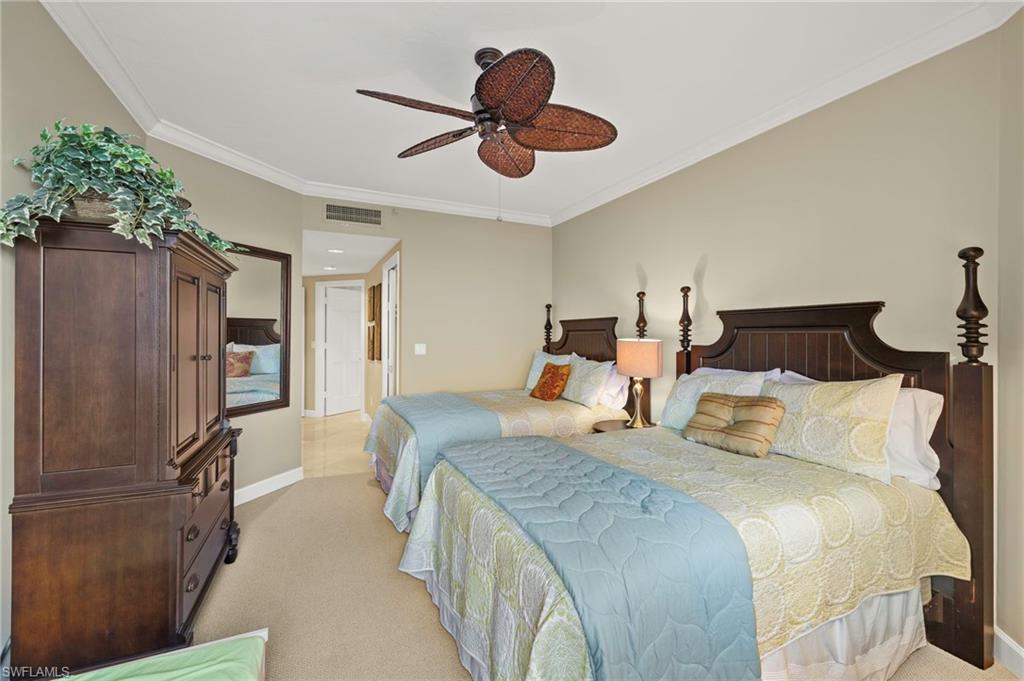 8990 Bay Colony Drive, Unit 1002 Naples, FL 34108 - Photo 16 of 20 a bedroom with double bed and a window