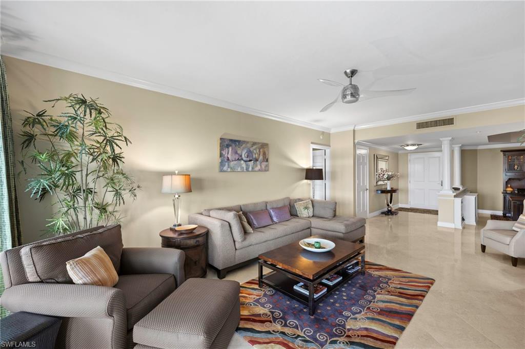 8990 Bay Colony Drive, Unit 1002 Naples, FL 34108 - Photo 5 of 20 a living room with furniture