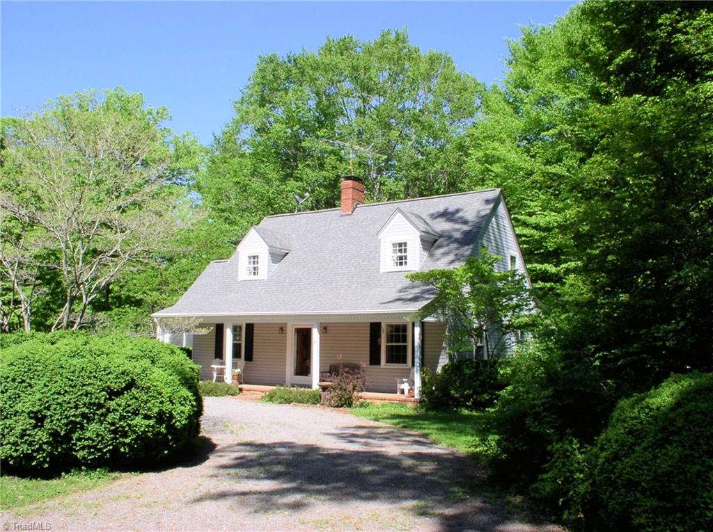 383 Hawthorne Road Elkin, NC 28621 - Photo 1 of 30 Traditional Cape Code style home with charming circle drive. New roof in 2007.