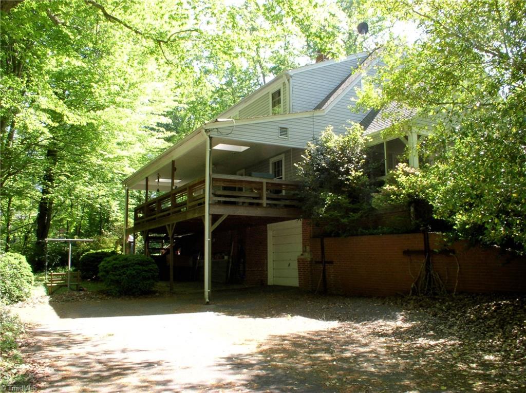 383 Hawthorne Road Elkin, NC 28621 - Photo 26 of 30 View of back of the house, driveway and one-car garage.