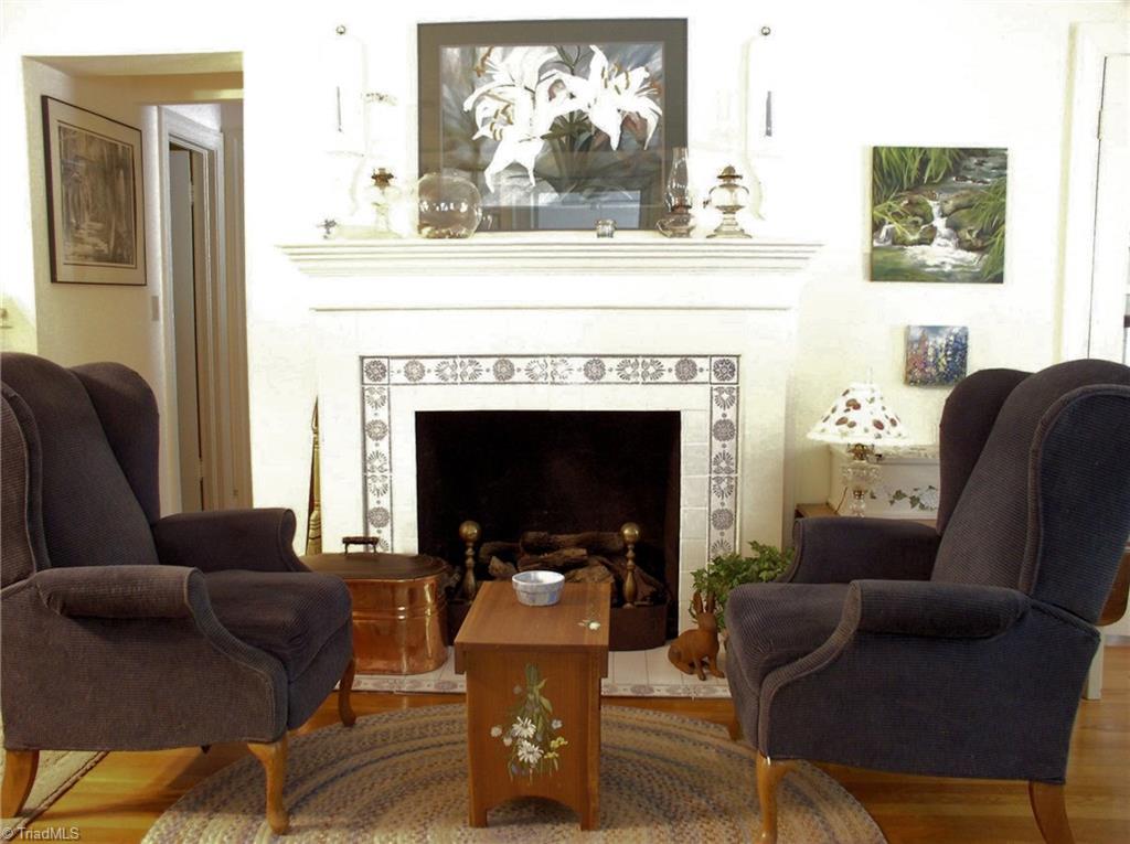 383 Hawthorne Road Elkin, NC 28621 - Photo 5 of 30 Living room features wood burning fireplace or gas logs.