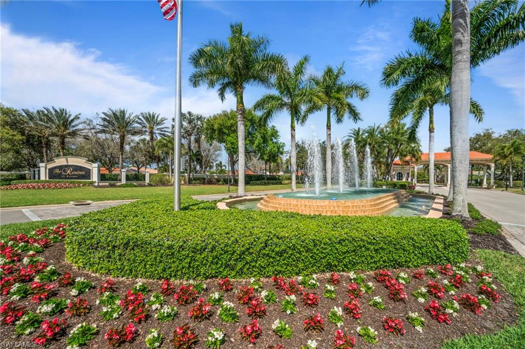 19753 Tesoro Way Estero, FL 33967 - Photo 38 of 47 a view of a fountain in front of a house with a big yard and fountain