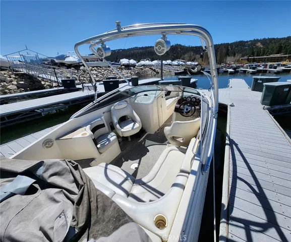a view of a dining table with paintings on the wall