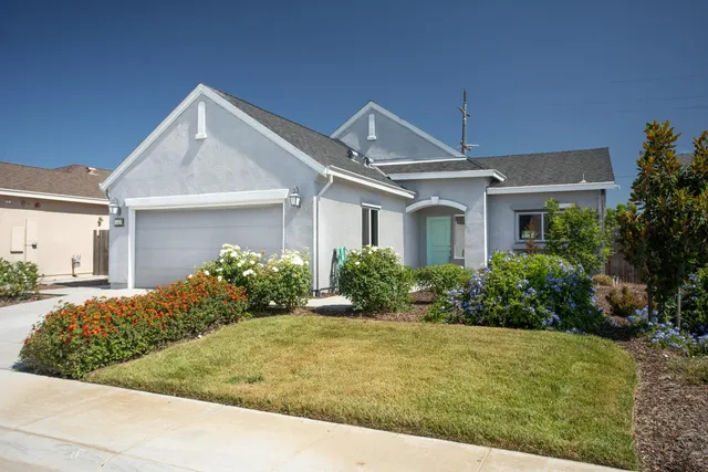 front view of a house and a yard