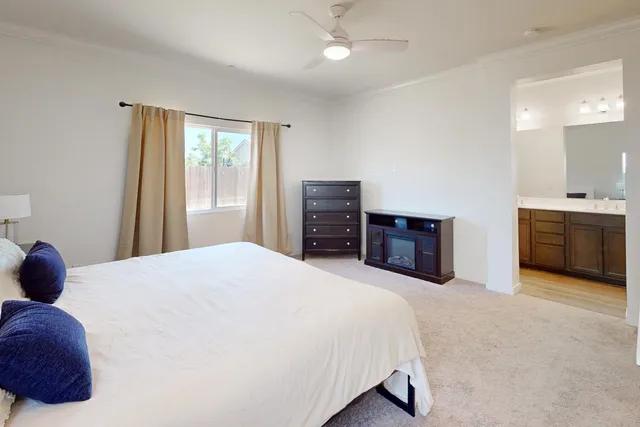 a bedroom with a bed and dresser