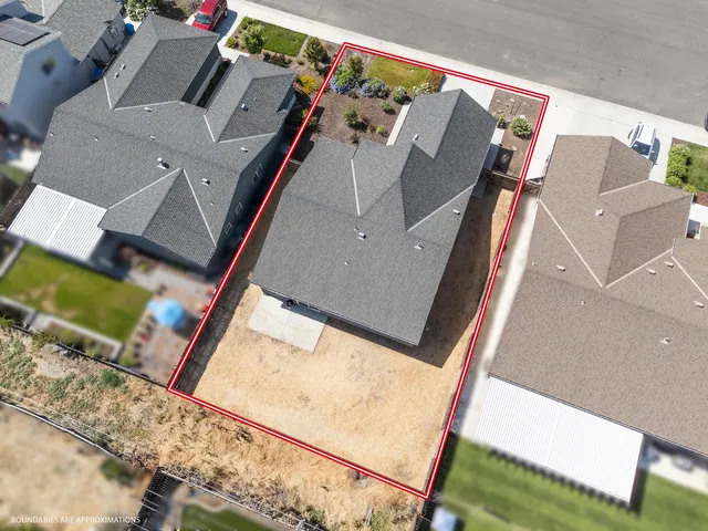 an aerial view of a house with a ocean view