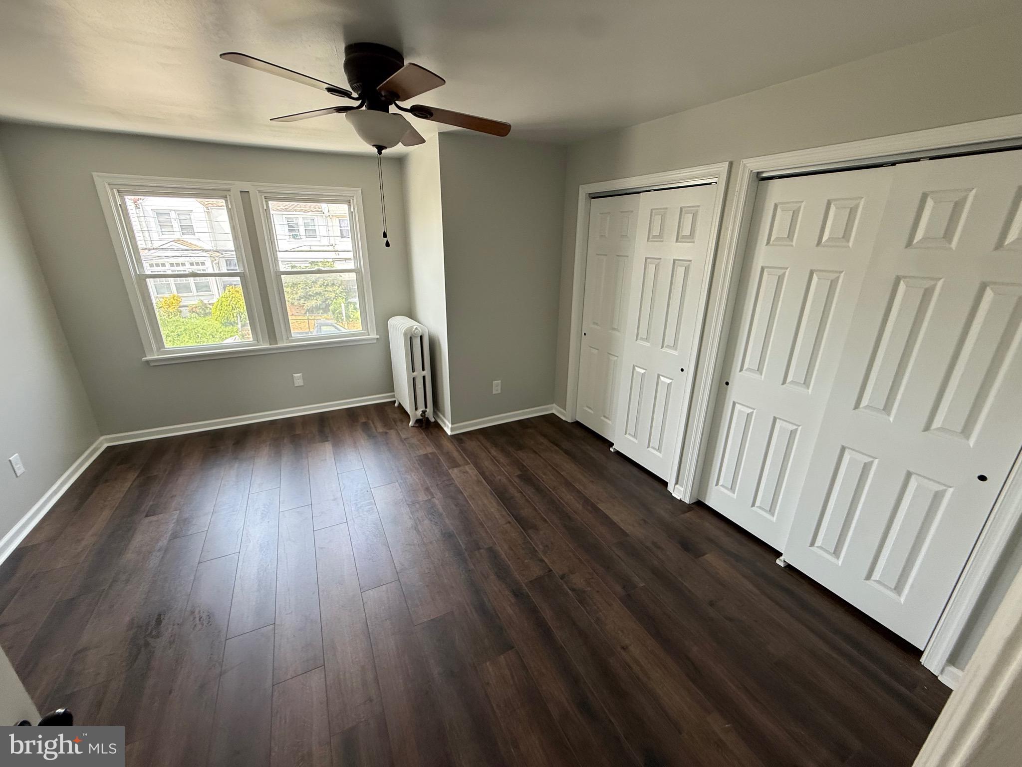 7150 Radbourne Road Upper Darby, PA 19082 - Photo 15 of 16 wooden floor in an empty room with a window