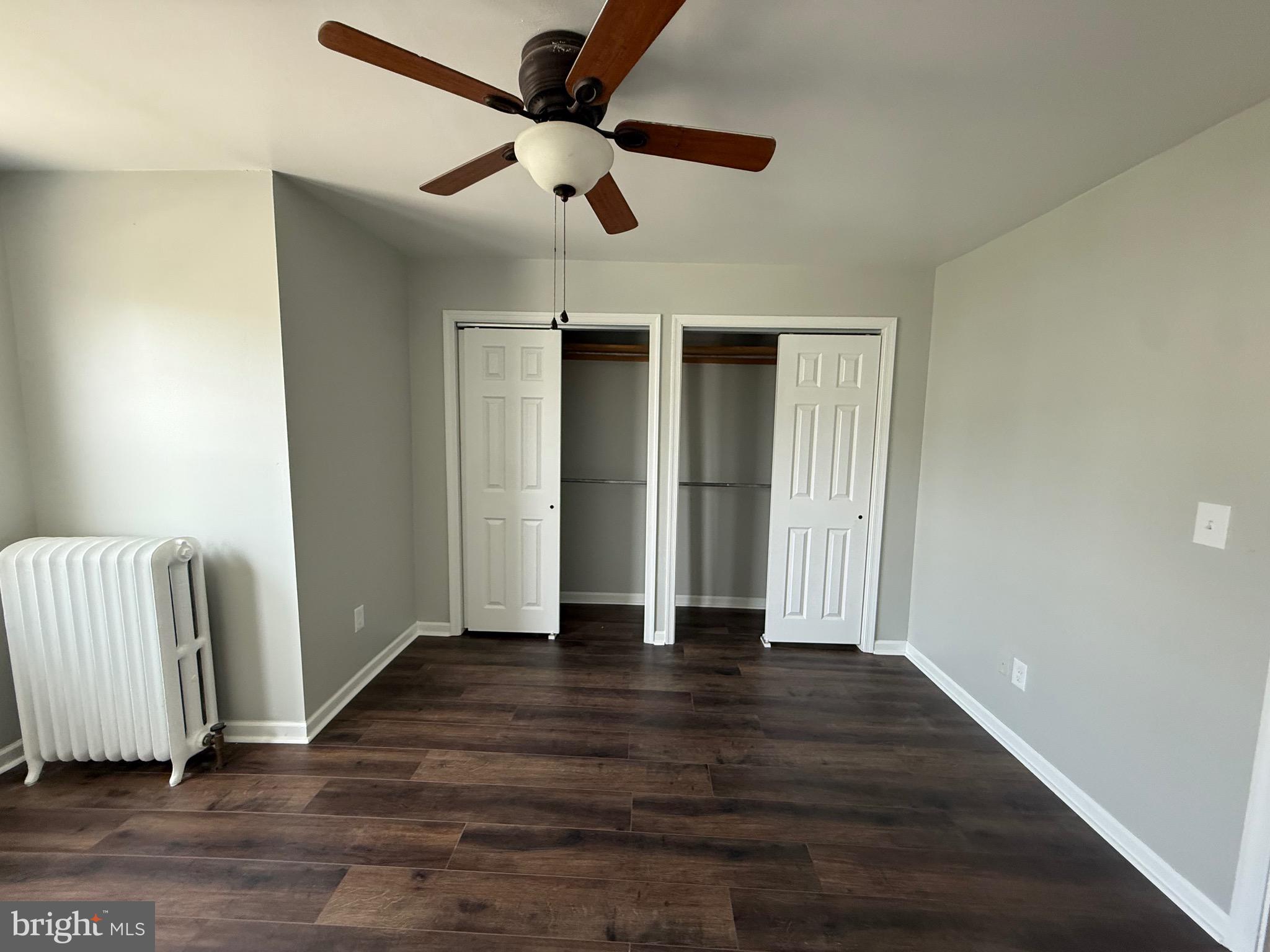 7150 Radbourne Road Upper Darby, PA 19082 - Photo 16 of 16 wooden floor in an empty room with a window