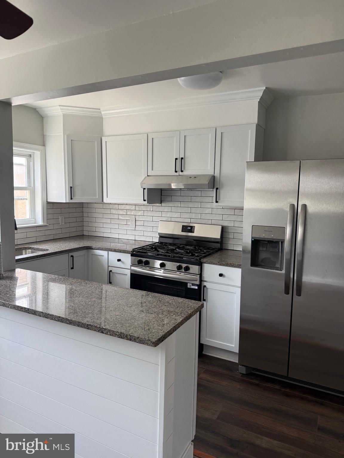 7150 Radbourne Road Upper Darby, PA 19082 - Photo 4 of 16 a kitchen with stainless steel appliances granite countertop a sink stove and refrigerator