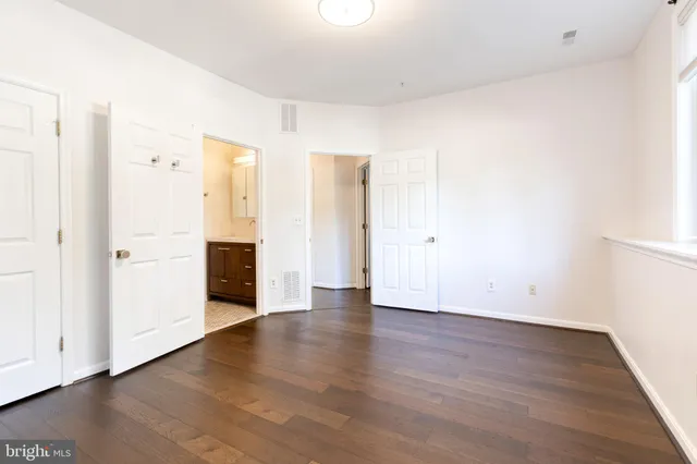 an empty room with wooden floor