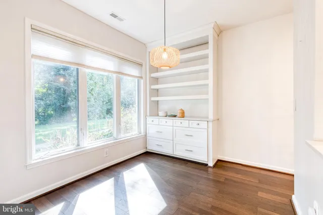 a room with window and cabinet