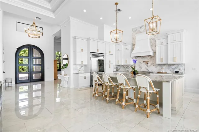 a very nice looking dining room with chandelier
